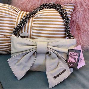 Juicy Couture bow chain lamb leather clutch bag